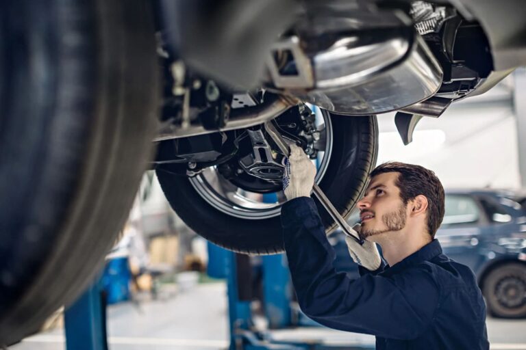 Auto car repair service center examining car suspension